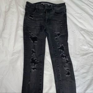 Black denim jeans with rips